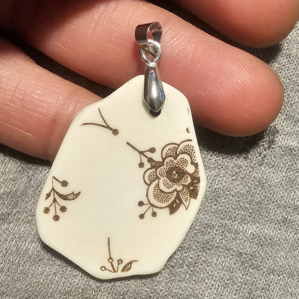 Elegant Floral Pendant in Cream and Brown